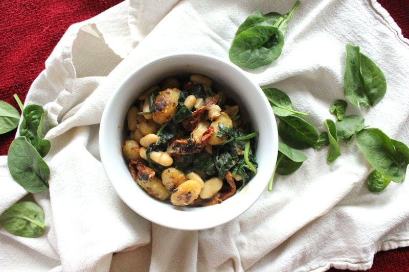 Creamy One-Pot Sun Dried Tomato Gnocchi With White Beans, Pine Nuts and Spinach